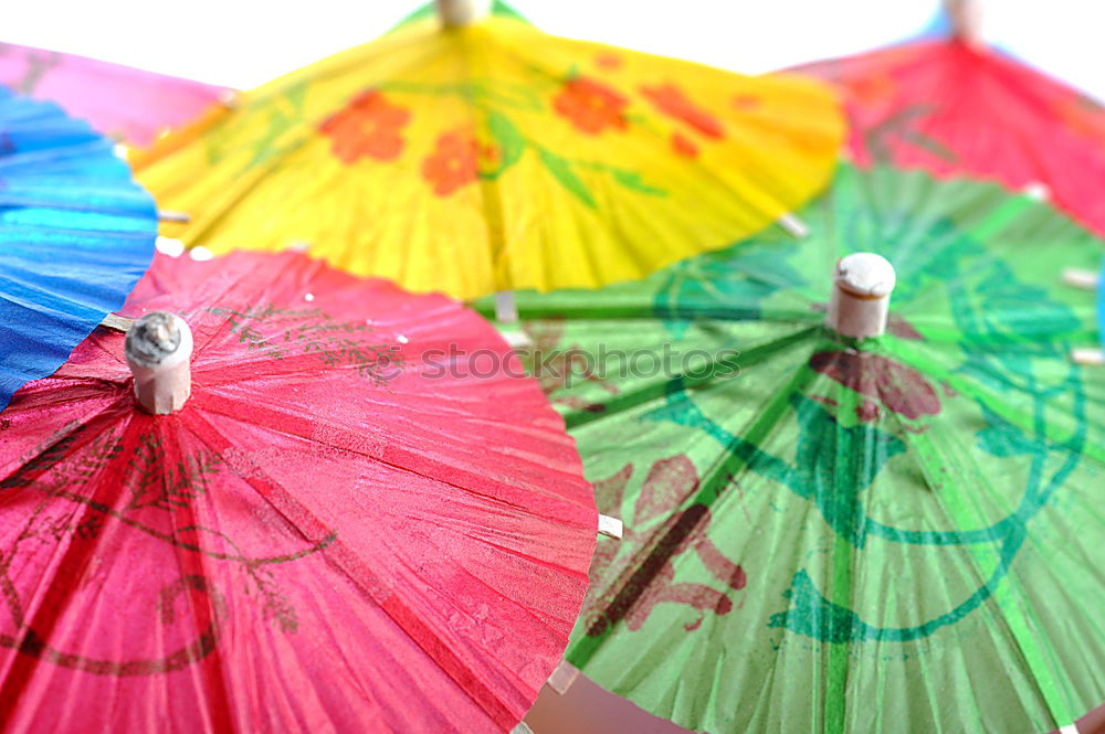 Similar – Rain on umbrella in rainbow colors under heavy rain against background of cloudy sky. Rainy weather concept.