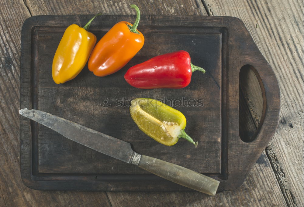 Similar – Multicolored peppers on wood