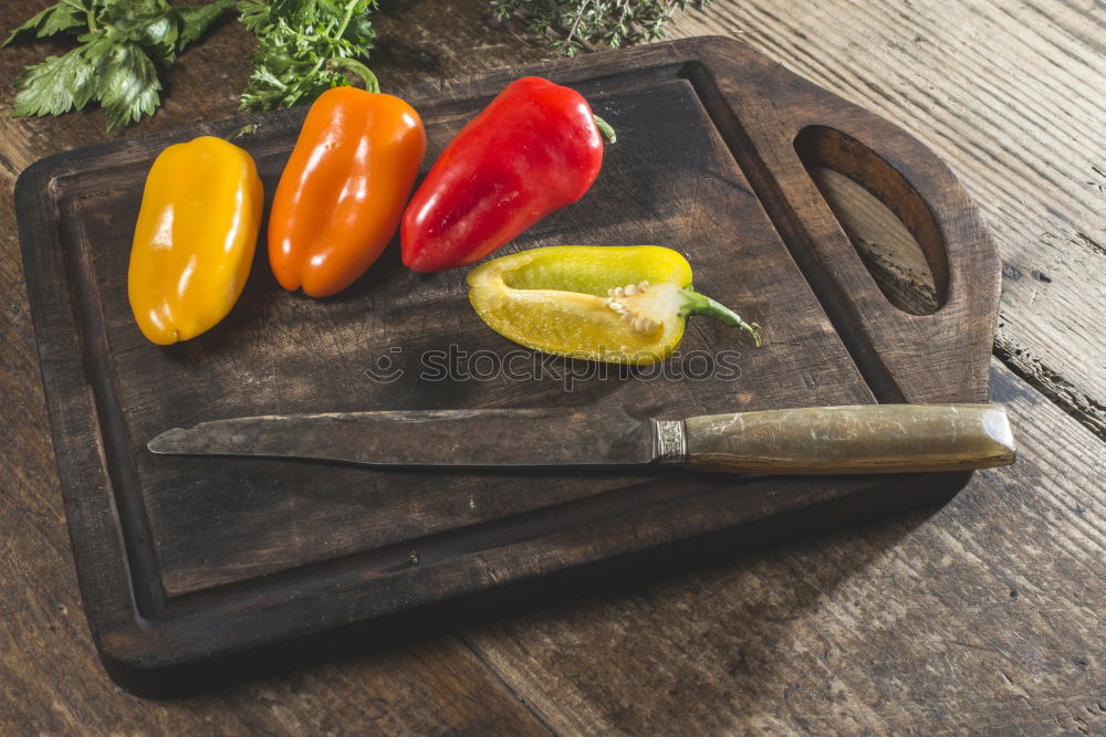 Similar – brown cutting board with a knife