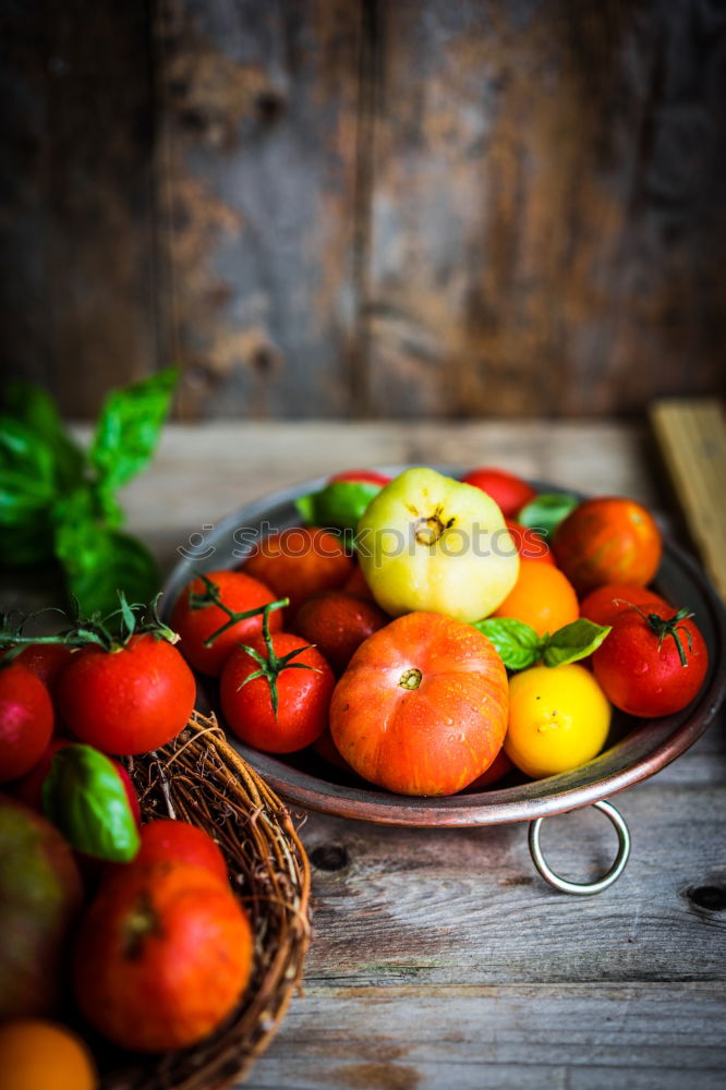 Similar – Image, Stock Photo Colorful tomatoes on the kitchen table with basil