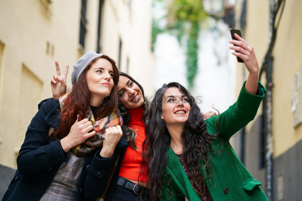 Similar – Lifestyle sunny image of best friend girls taking selfie