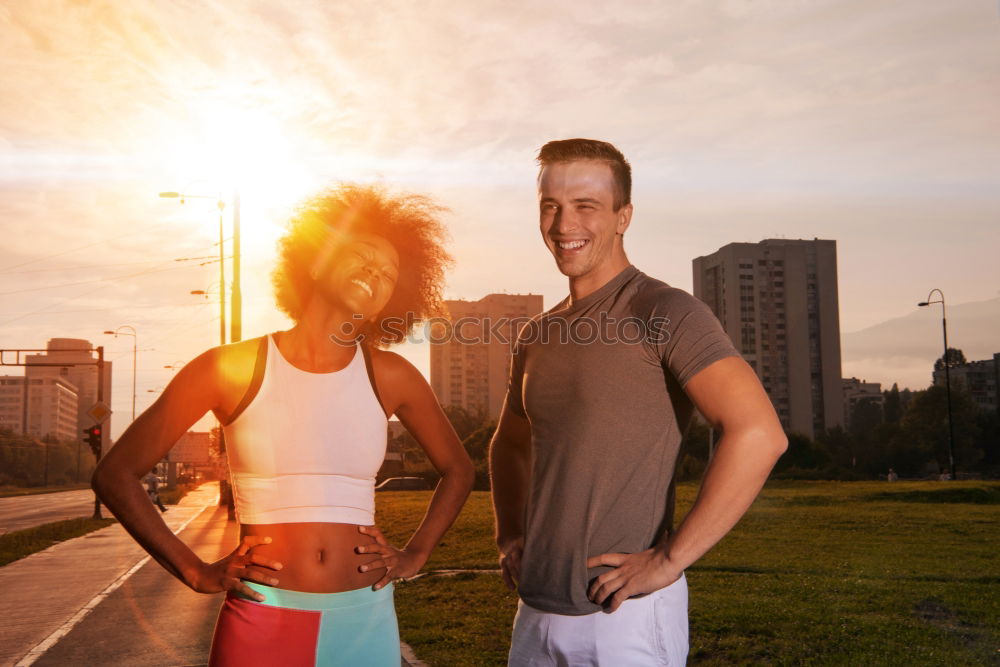 Similar – Active young couple jogging side by side in an urban street