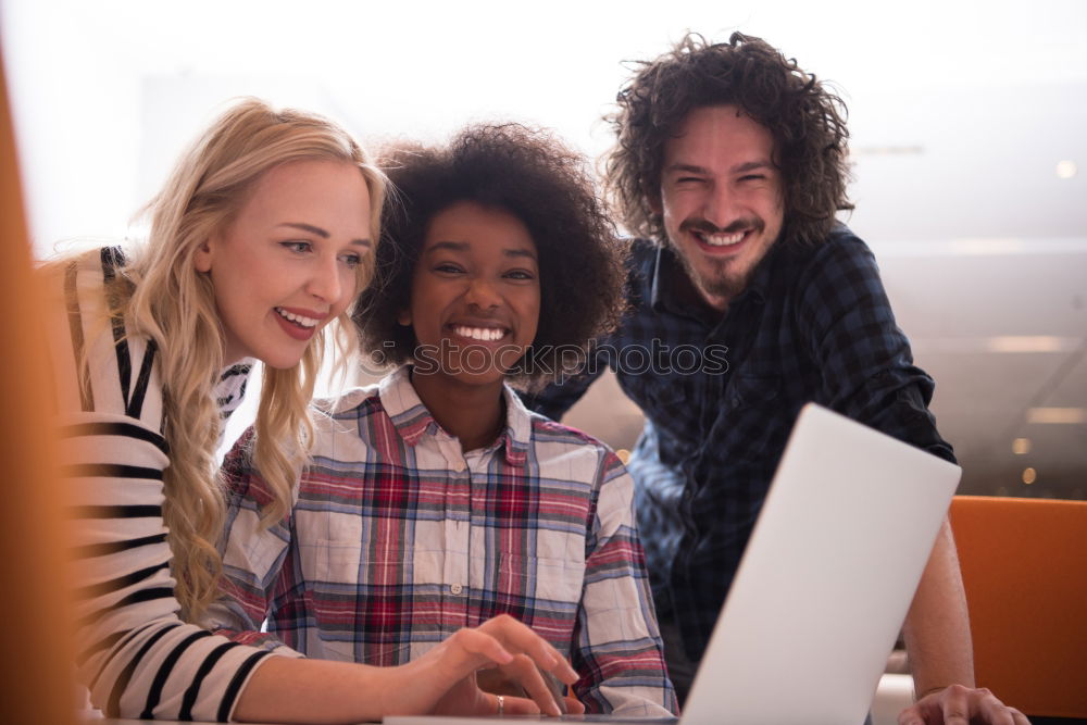 Similar – Image, Stock Photo Multiracial young people looking at a tablet computer