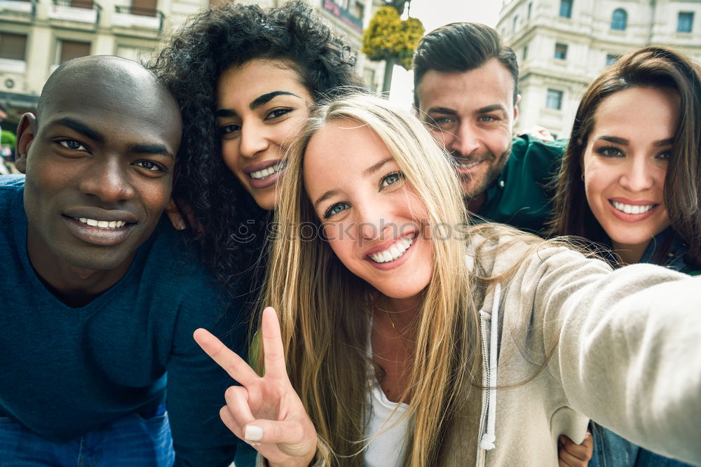 Similar – Image, Stock Photo Group of friends taking selfie in urban background.