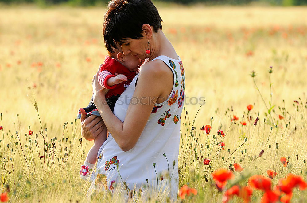 Similar – Image, Stock Photo Happy mother with her little daughter in poppy field