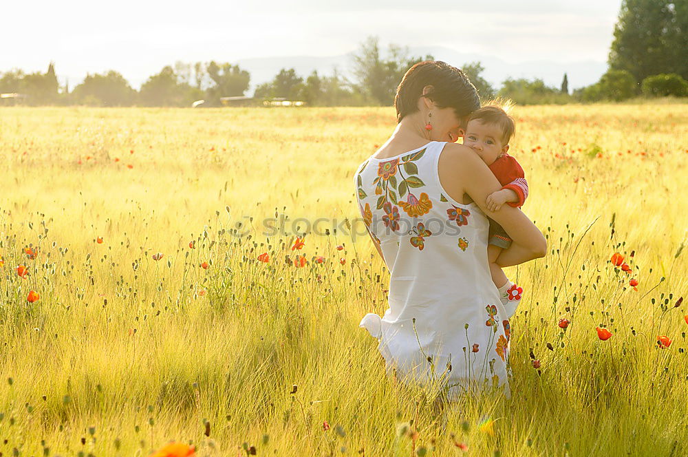 Similar – Image, Stock Photo Happy mother with her little daughter in poppy field