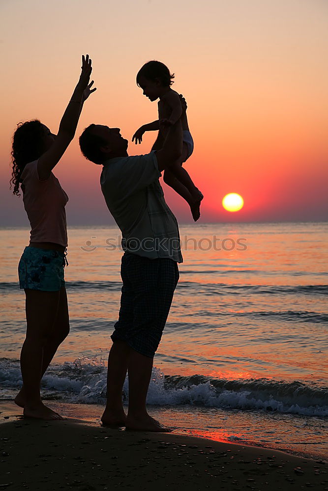 Similar – Happy children playing on the beach at the sunset time. Three Kids having fun outdoors. Concept of summer vacation and friendly family.