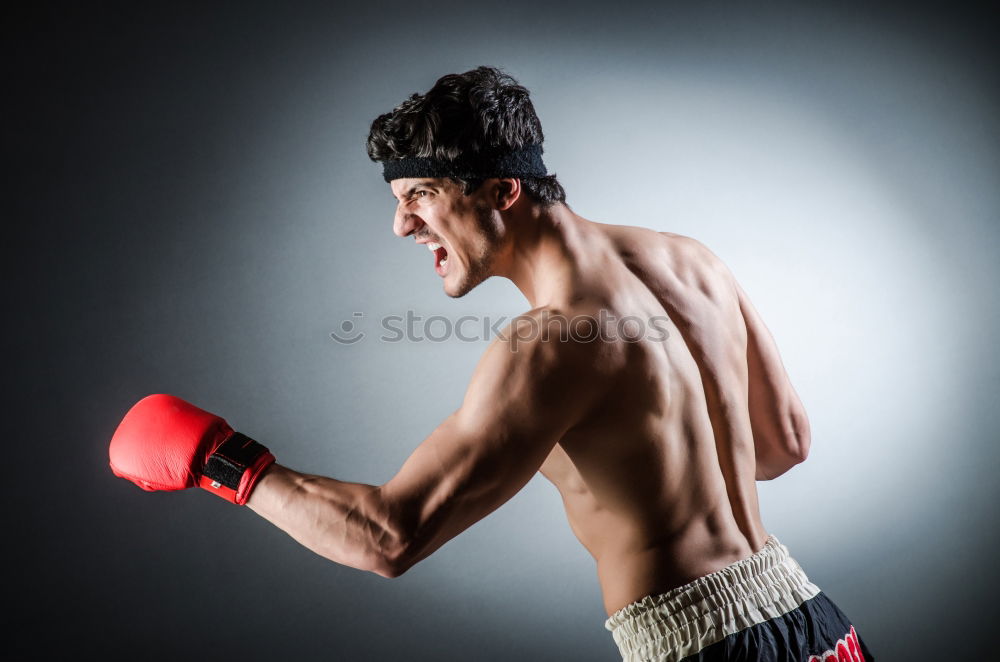 Similar – Image, Stock Photo Young thai boxing man is doing a workout for fight