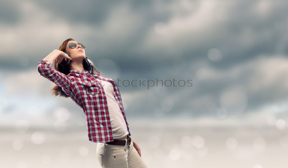 Similar – Image, Stock Photo A woman with a red cap stands in front of a wind turbine. Climate change. Alternative power generation. Renewable energy