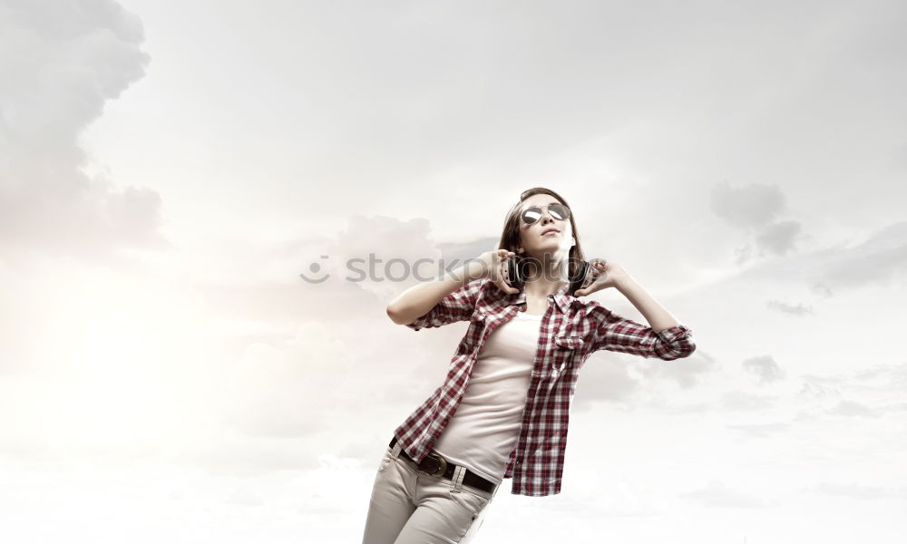 Similar – Young woman sitting on the street