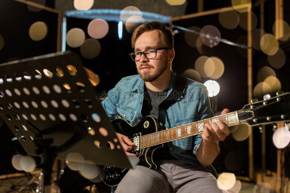 Similar – Image, Stock Photo Guitarist sitting on guitar combo