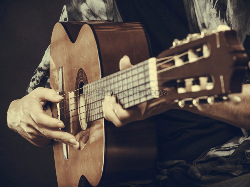 Similar – Image, Stock Photo Man playing guitar and composing music at home near a bright window on a sunny day. Casual musician sitting on the floor playing the guitar.