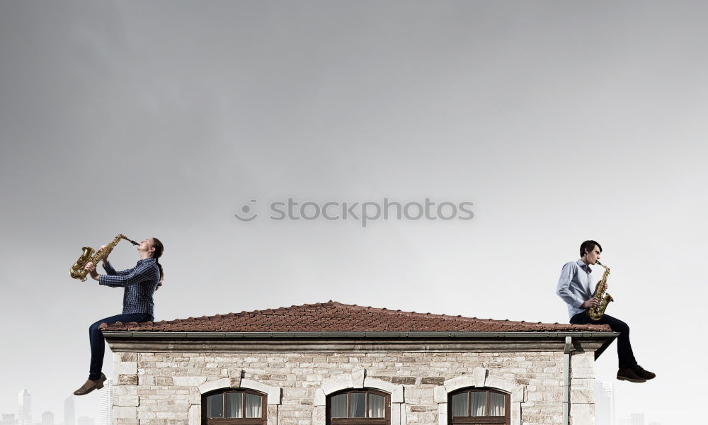 Similar – Two businessmen shaking hands in the air