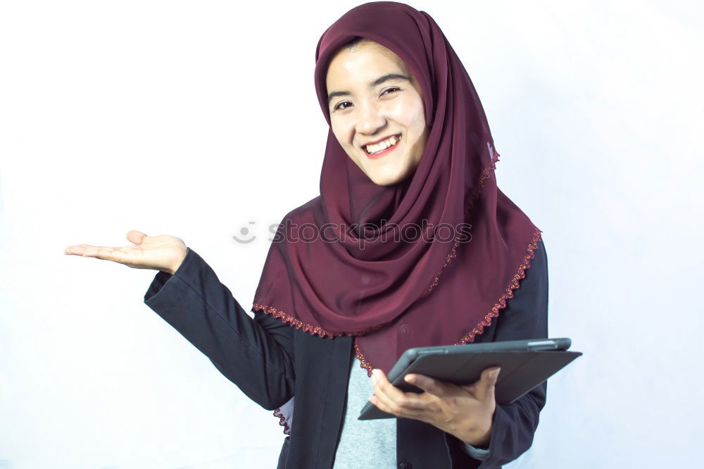 Similar – Smiling young woman wearing hijab outdoors