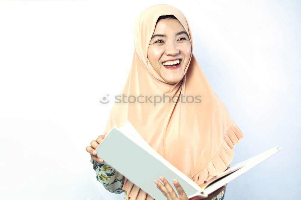 Similar – Smiling young woman wearing hijab outdoors