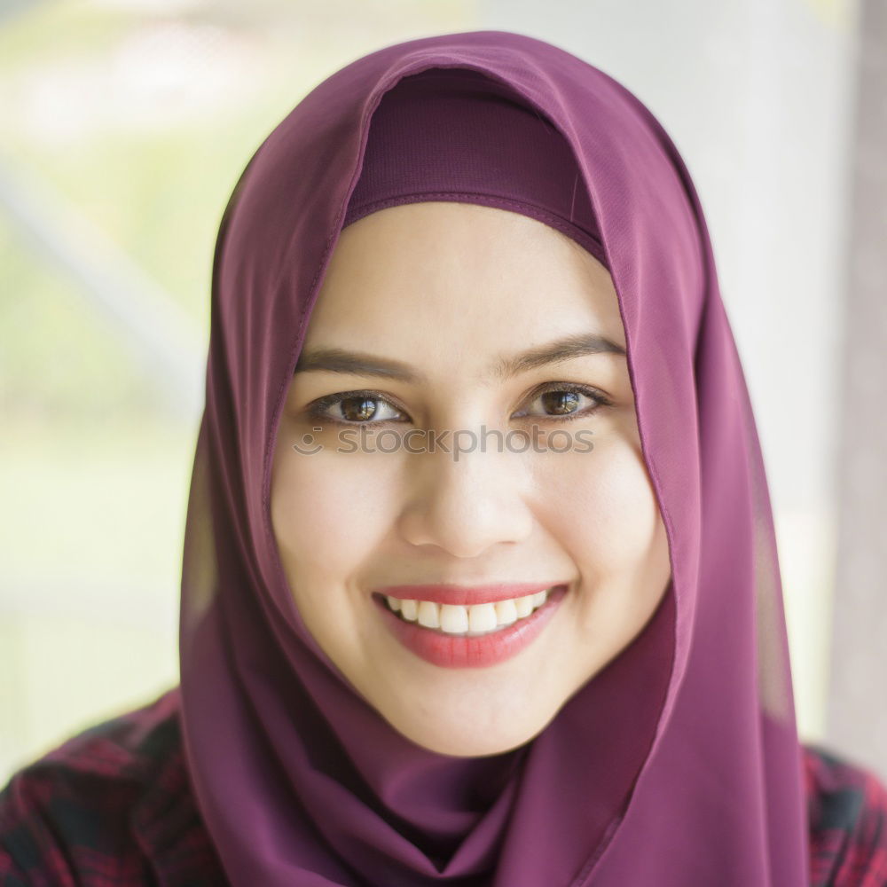 Similar – Smiling young woman wearing hijab outdoors