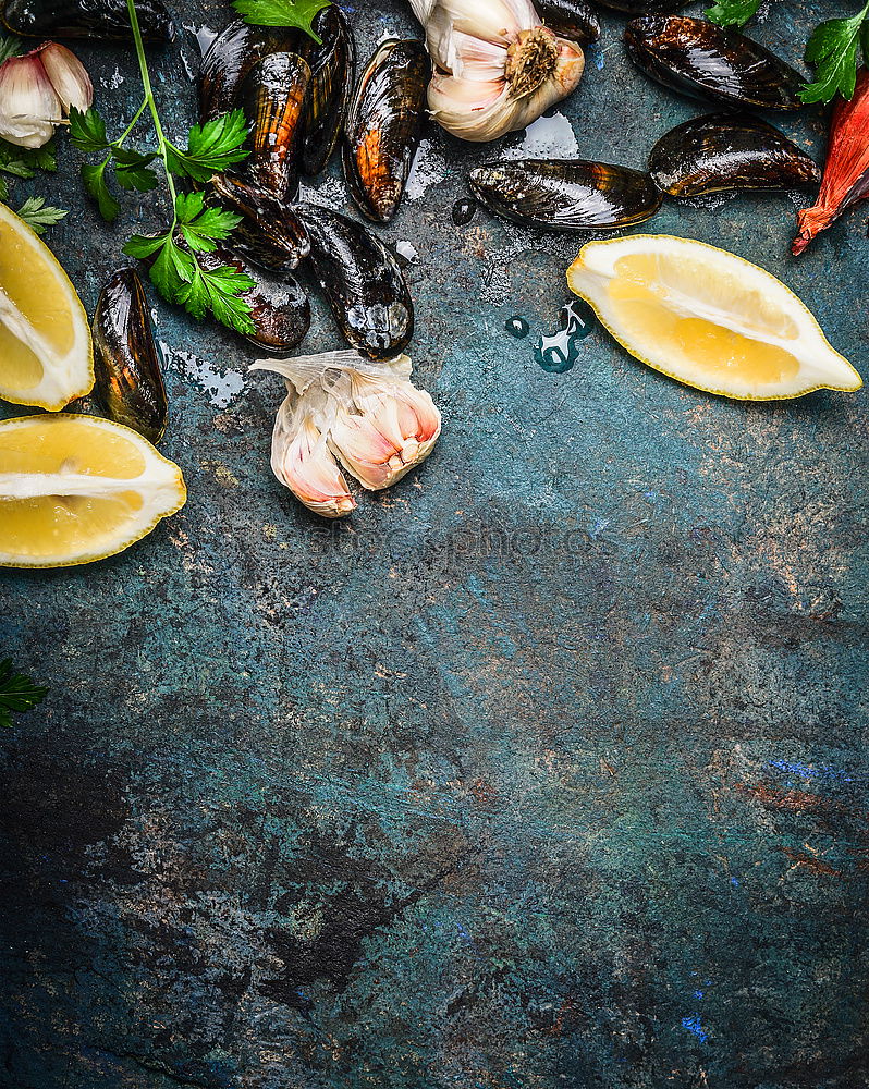 Mussels with lemon and ingredients for cooking