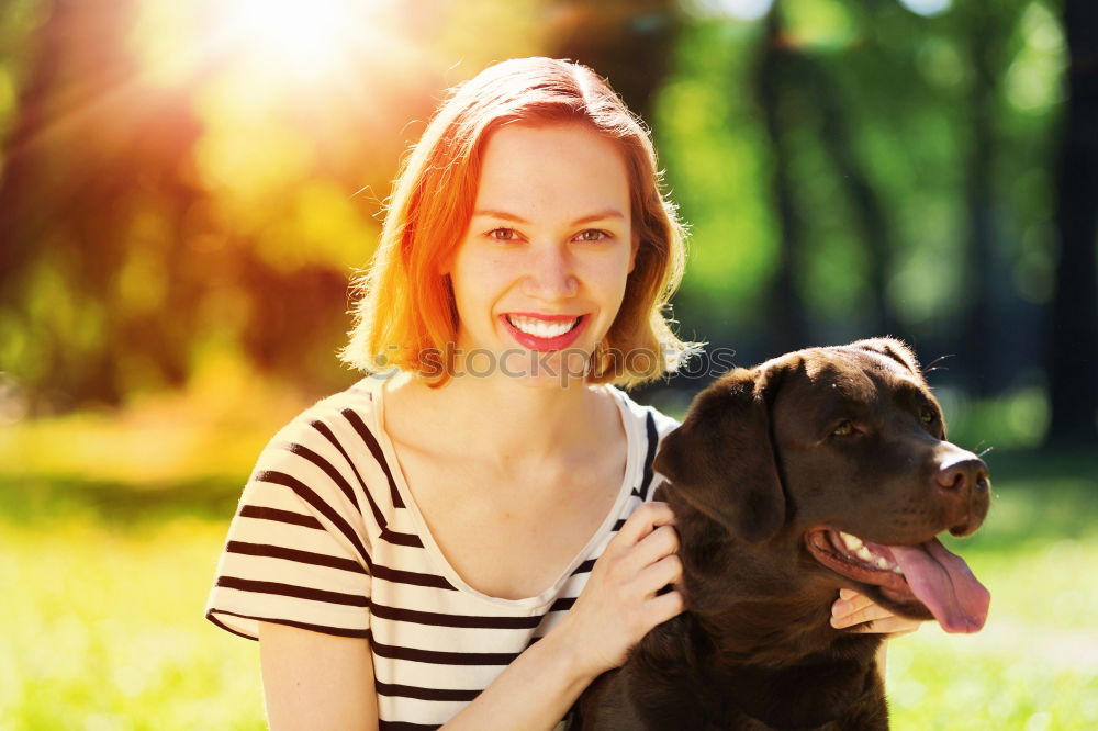 Similar – Happy smiling dog with its pretty young owner