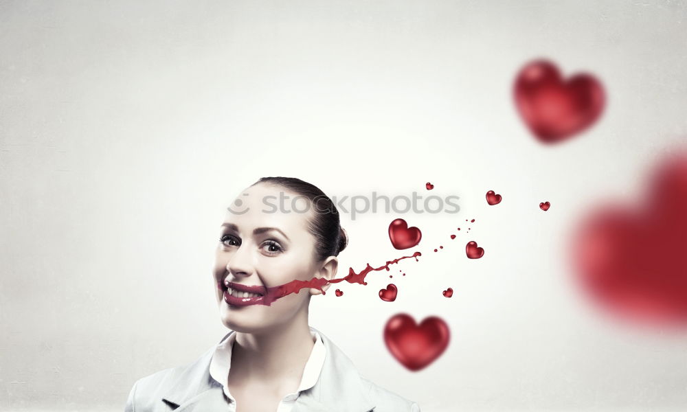 Similar – Young woman holding a red heart