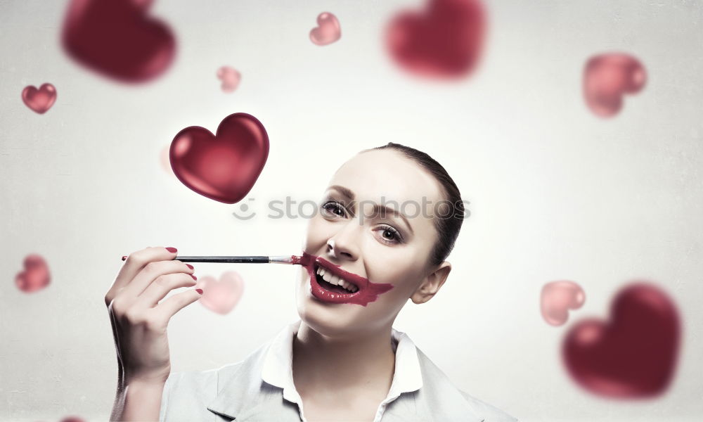 Similar – Young woman holding a little red tree