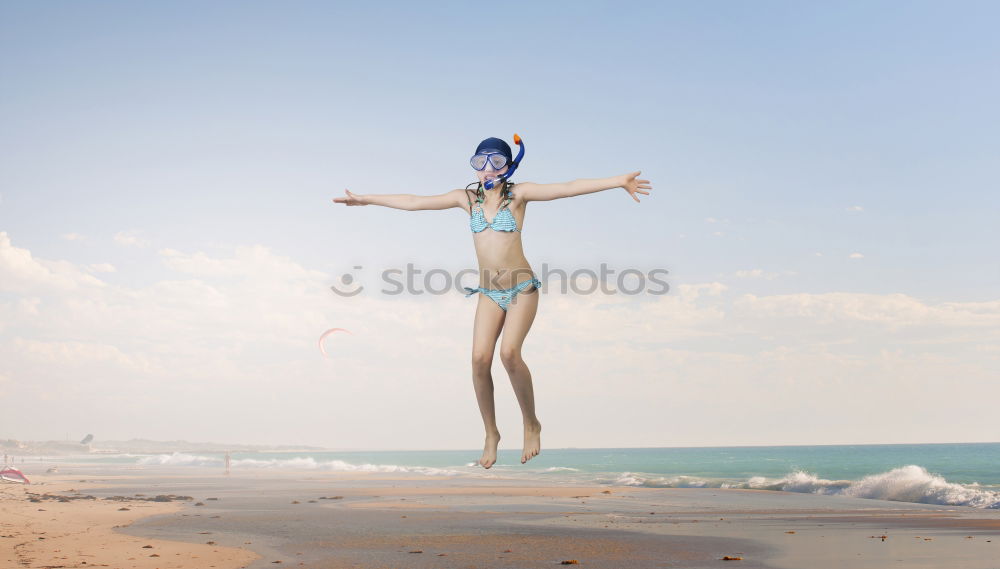 Image, Stock Photo Mini pincher dog playing on the beach.