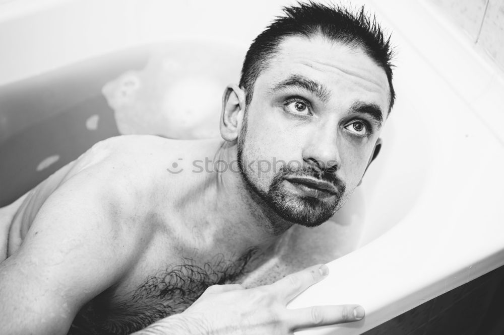 Similar – Friendly young man soaping himself in the shower