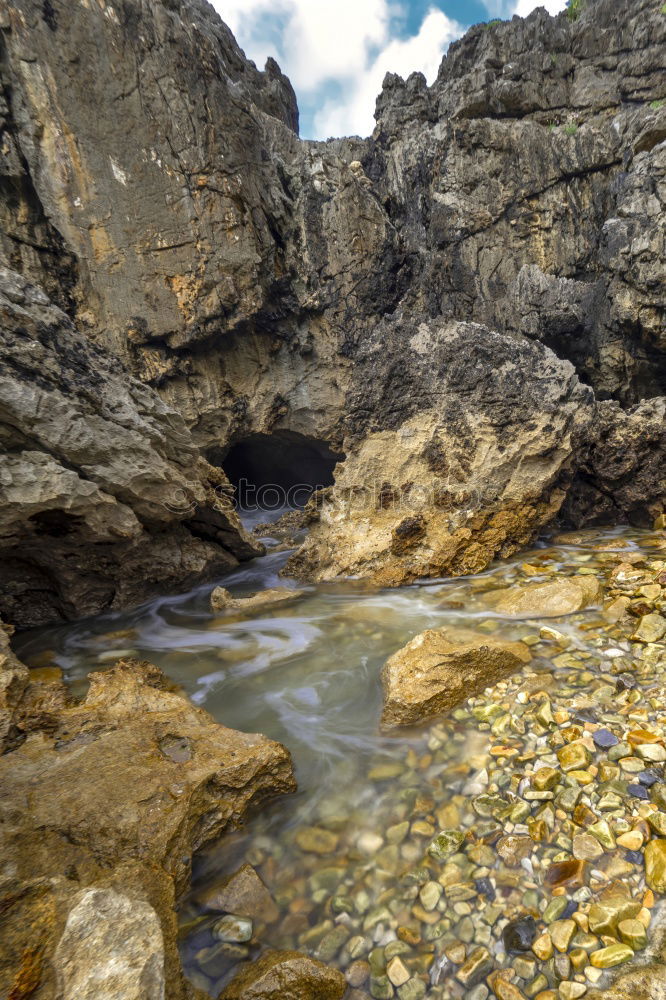 Similar – A Natural Arch on the Coast at Golden Hour