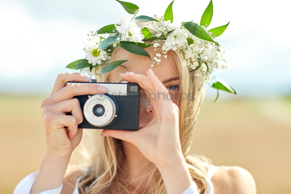 Similar – Image, Stock Photo Lady with camera on shore near stones and water