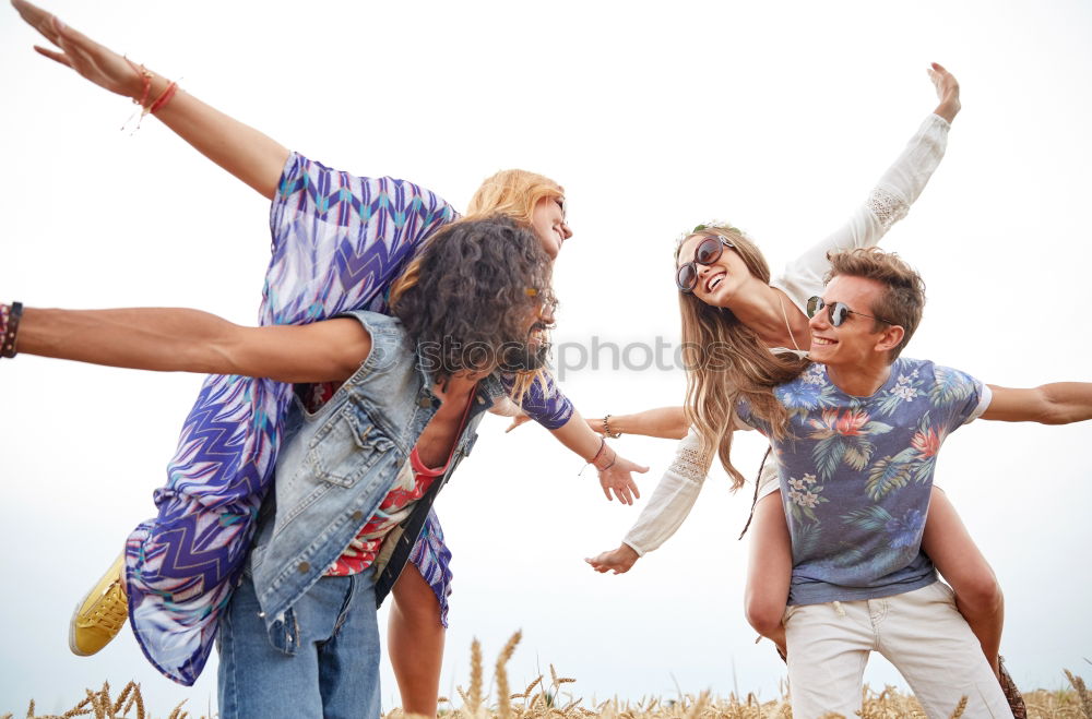 Similar – Happy family standing on the beach at the day time. People having fun outdoors. Concept of summer vacation and friendly family.