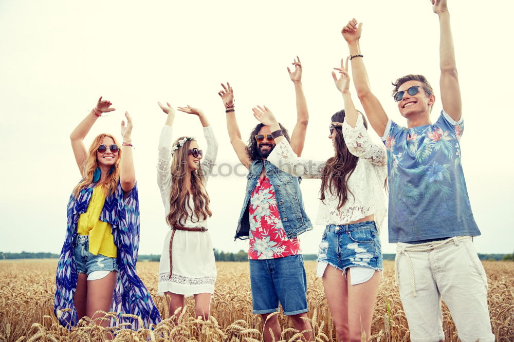 Similar – Image, Stock Photo Group of hipster friends cheering with confetti in sunset