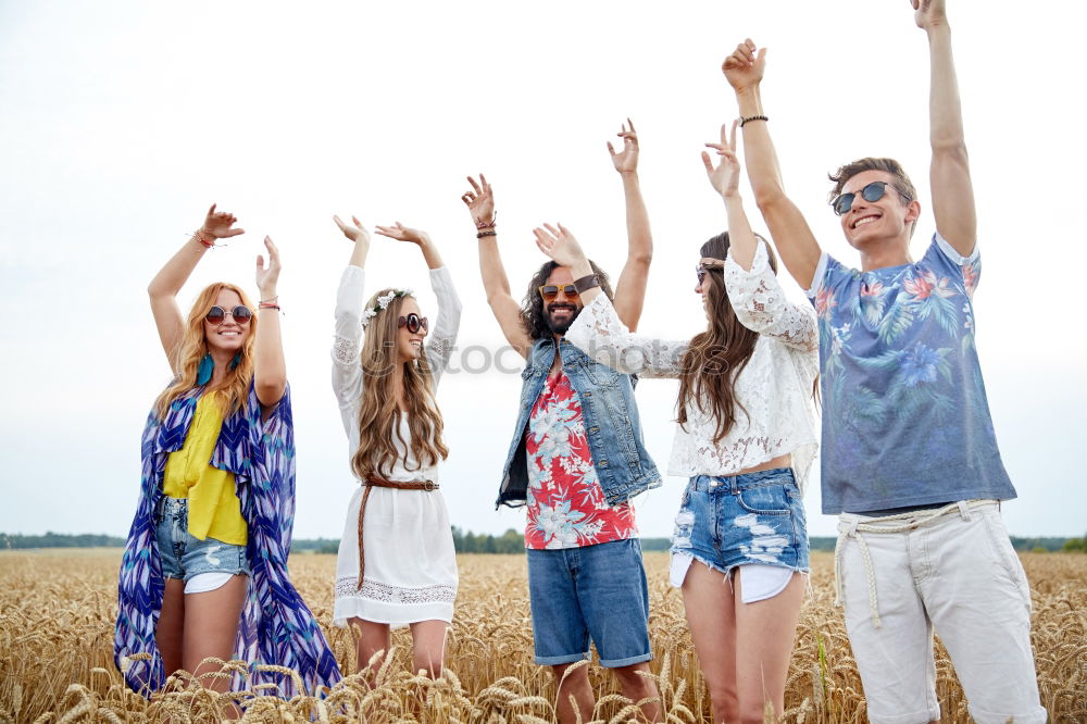 Similar – Image, Stock Photo Group of hipster friends cheering with confetti in sunset