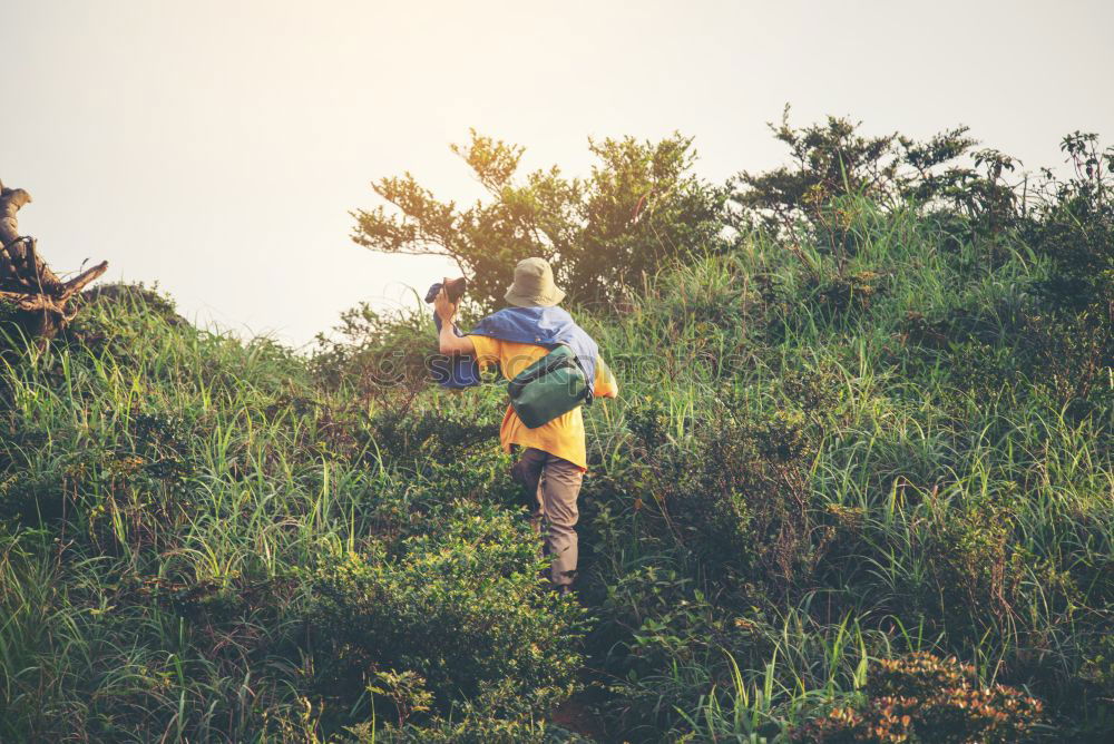 Image, Stock Photo Boy packing his clothes to backpack on trail