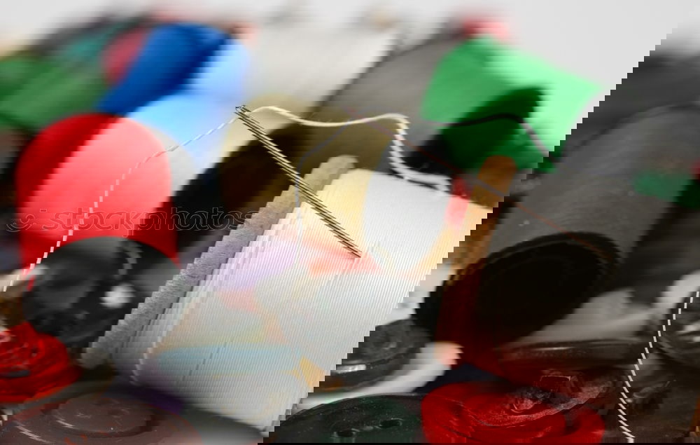 Similar – Image, Stock Photo Five old sewing thread thread rolls in pastel colours on wood