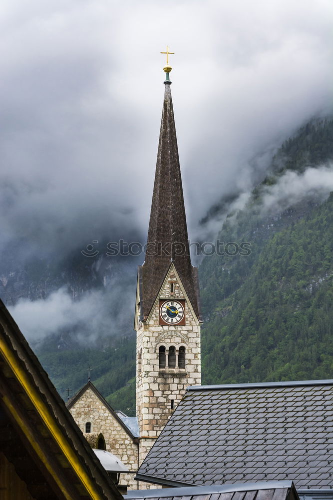 Similar – Church tower in front of foggy landscape