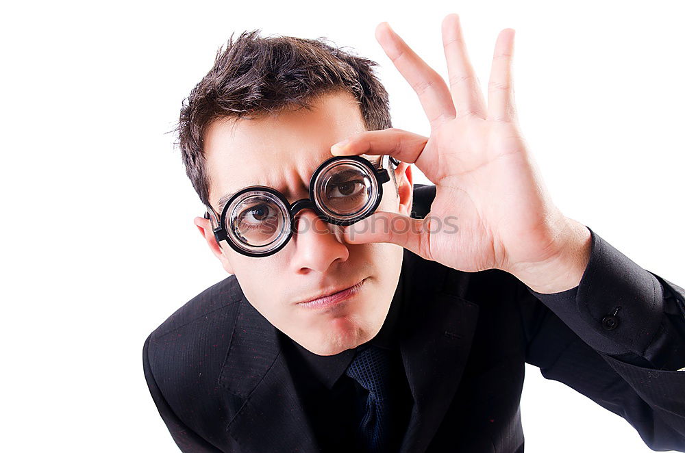 Similar – The man looking through a magnifier with suspicious