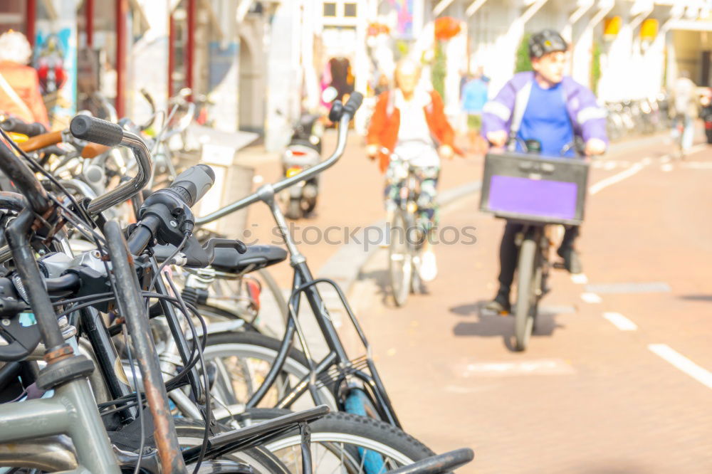 Similar – Happy family with a child riding bicycles by the city