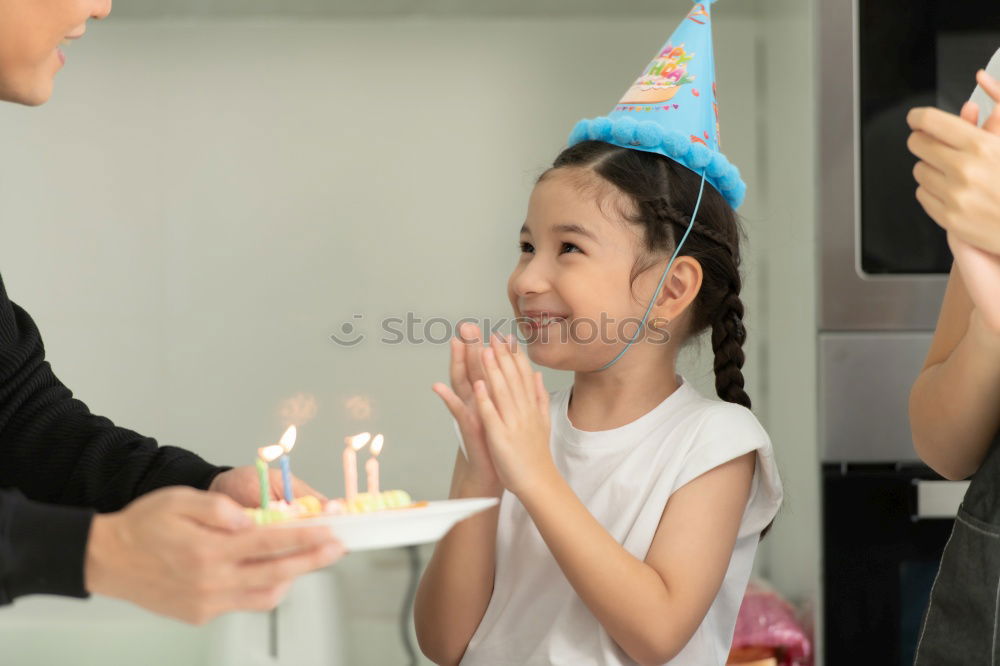 Similar – child girl playing checkers with her dad