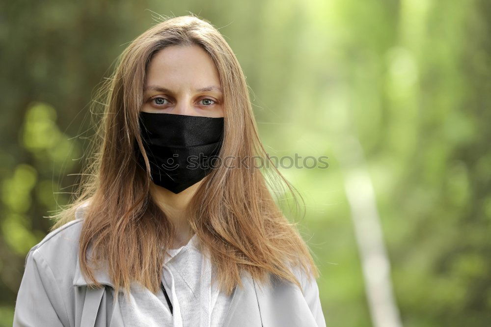 Similar – Image, Stock Photo Young pretty woman looks anxiously into the camera with wrinkled forehead and mask. Red Nose Day with funny, funny clown mask, with red bobble, pompom to protect against corona. Blonde, young, long-haired woman with cool face mask outside in the nature.