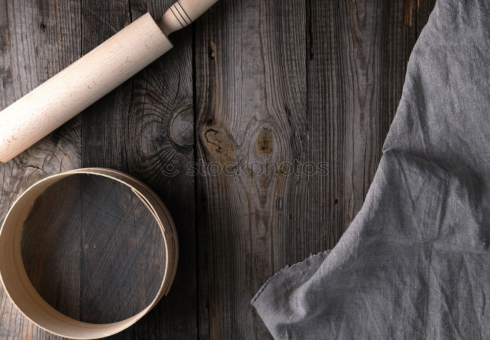 Similar – cast iron pan with a spatula on a gray textile napkin