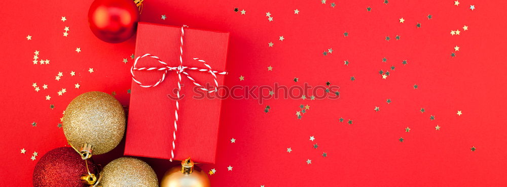 Red and white gift on red background. Copyspace