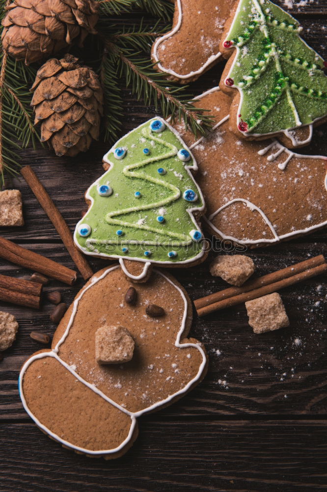 Similar – Image, Stock Photo Christmas cookies decorated with frosting on wooden board