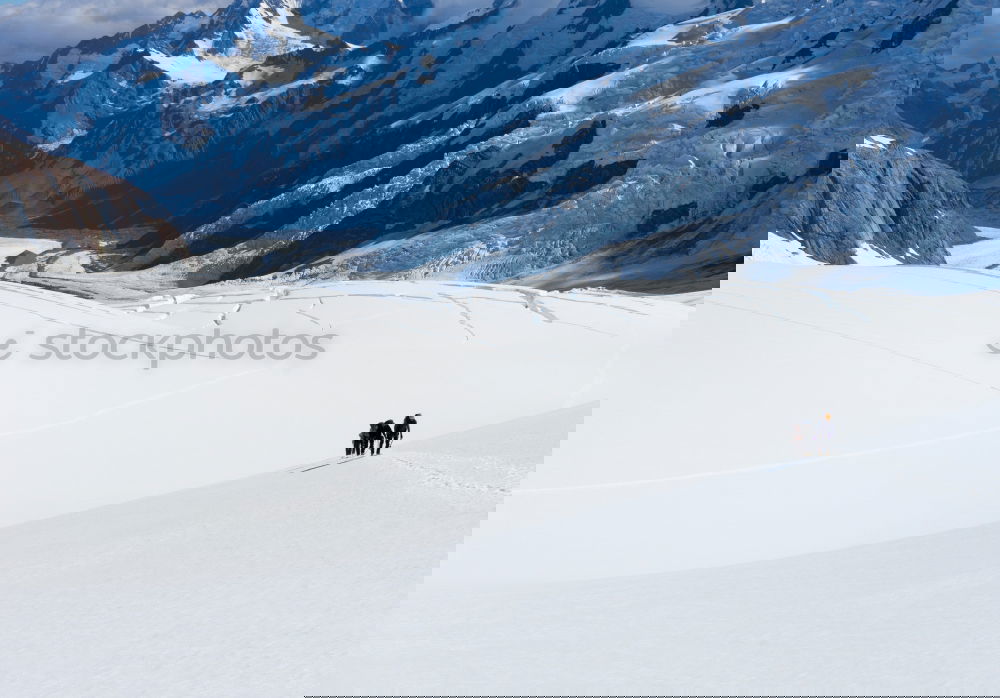 Similar – Image, Stock Photo A group of freeriders over a snowy mountain landscape.