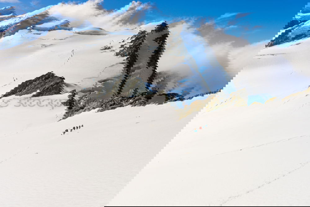 Similar – Image, Stock Photo A group of freeriders over a snowy mountain landscape.