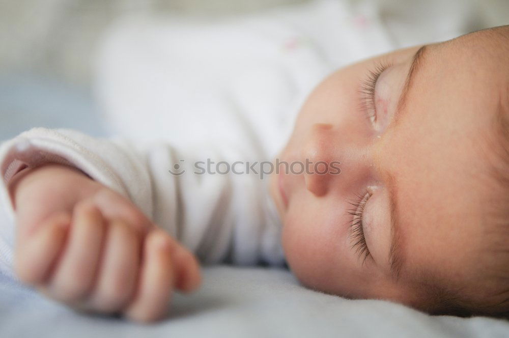 Similar – Image, Stock Photo Newborn baby girl sleeping on blue sheets at home