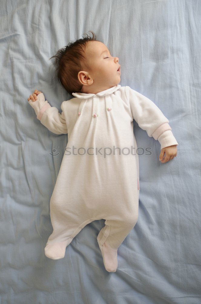Image, Stock Photo Newborn baby girl sleeping on blue sheets at home