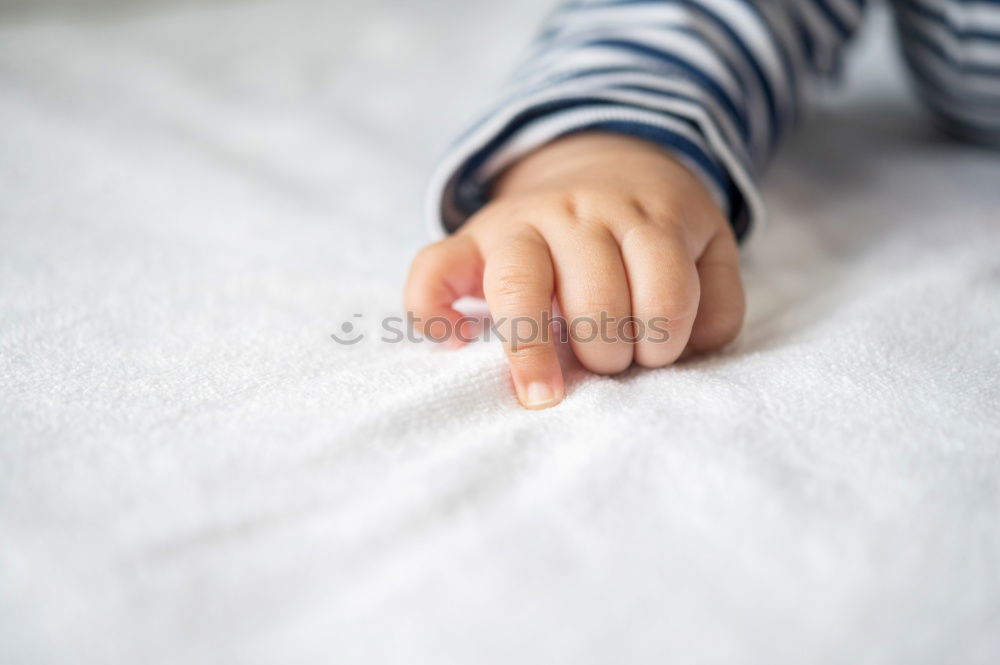 Similar – Image, Stock Photo 6 month old baby seated in high chair reaching into bowl of banana pieces; baby led weaning method