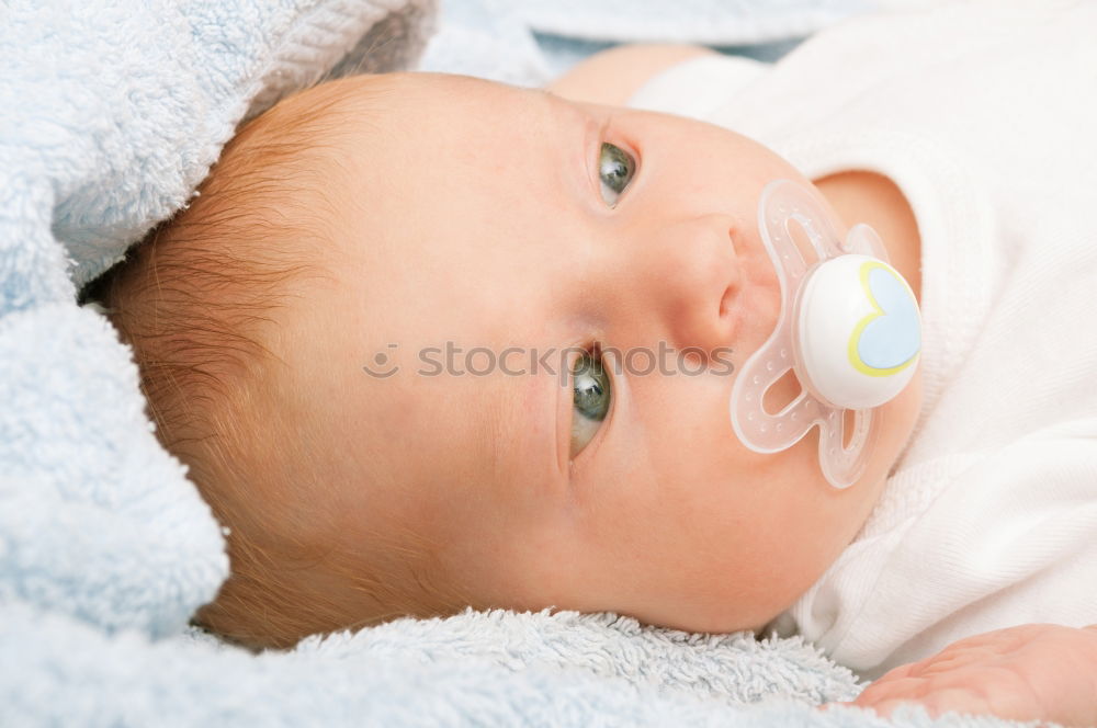 Similar – Baby taking feeding bottle