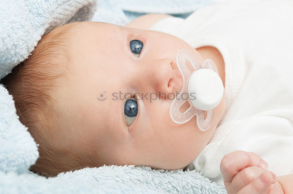 Baby taking feeding bottle