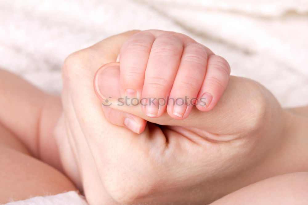 Similar – Hand of a small baby