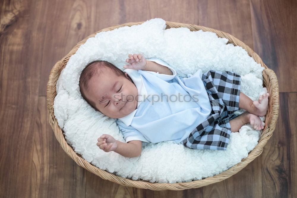 Similar – Image, Stock Photo Newborn baby resting lying above of travel suitcase